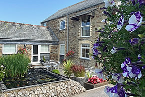 View over the courtyard towards Magpie Cottage