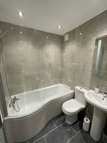 Bathroom/WC with over bath shower